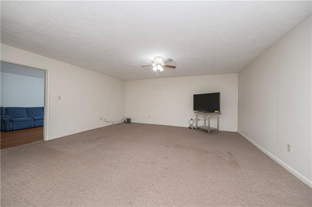7300 Hutchinson Road Elizabeth, PA 15037 - Photo 21 of 42 This large room sits between the side porch and the living room.