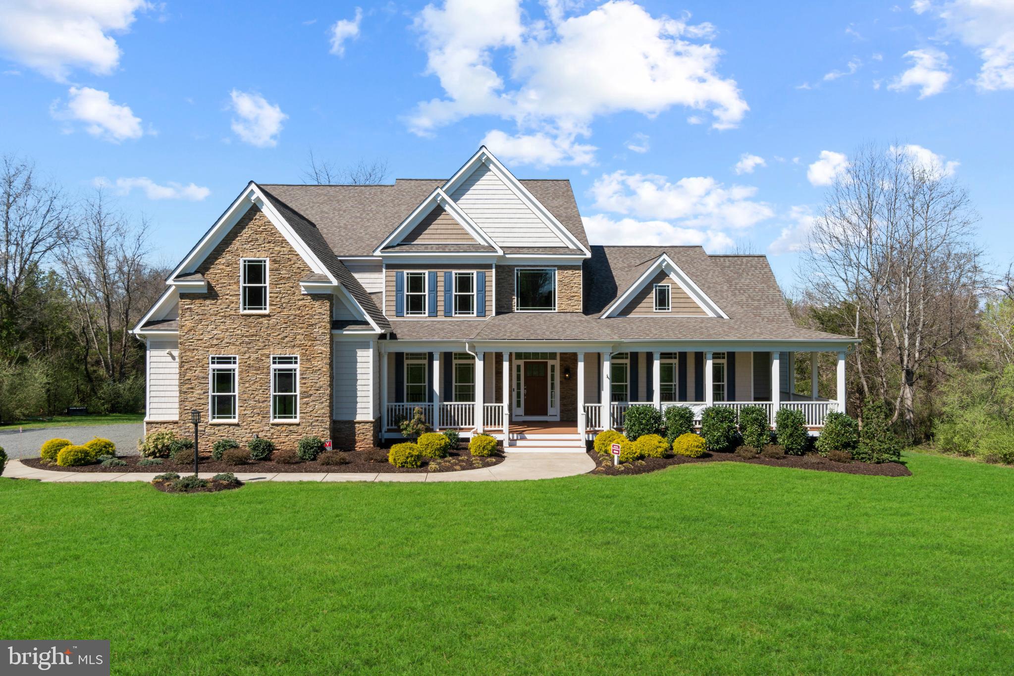 13725 Orlando Road Nokesville, VA 20181 - Photo 1 of 65 a front view of a house with a yard and potted plants