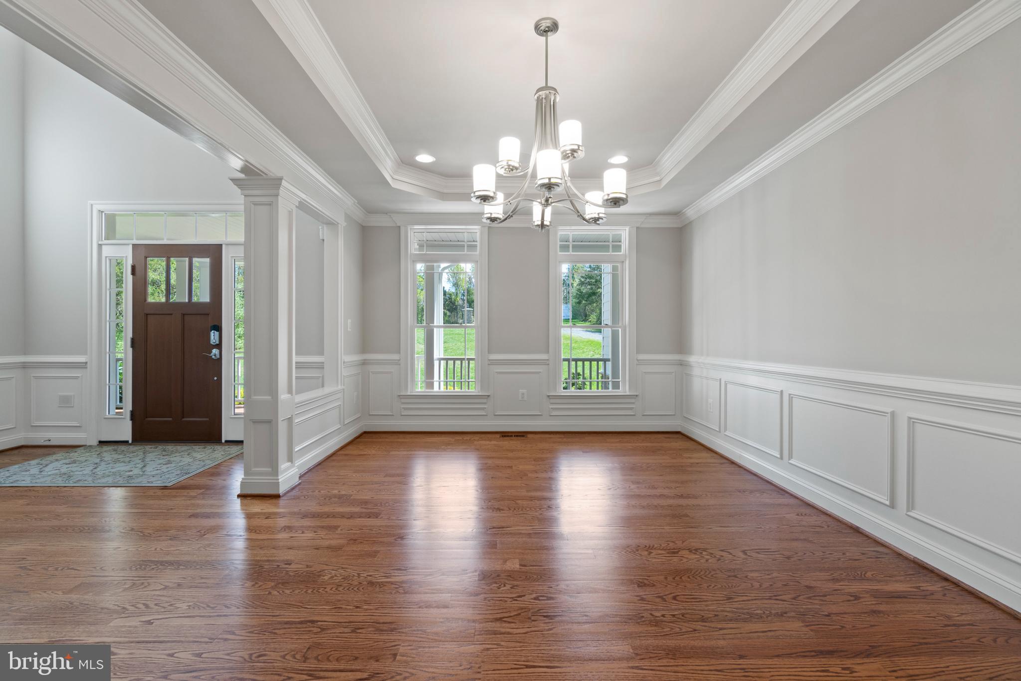 13725 Orlando Road Nokesville, VA 20181 - Photo 15 of 65 a view of an empty room with wooden floor and a window