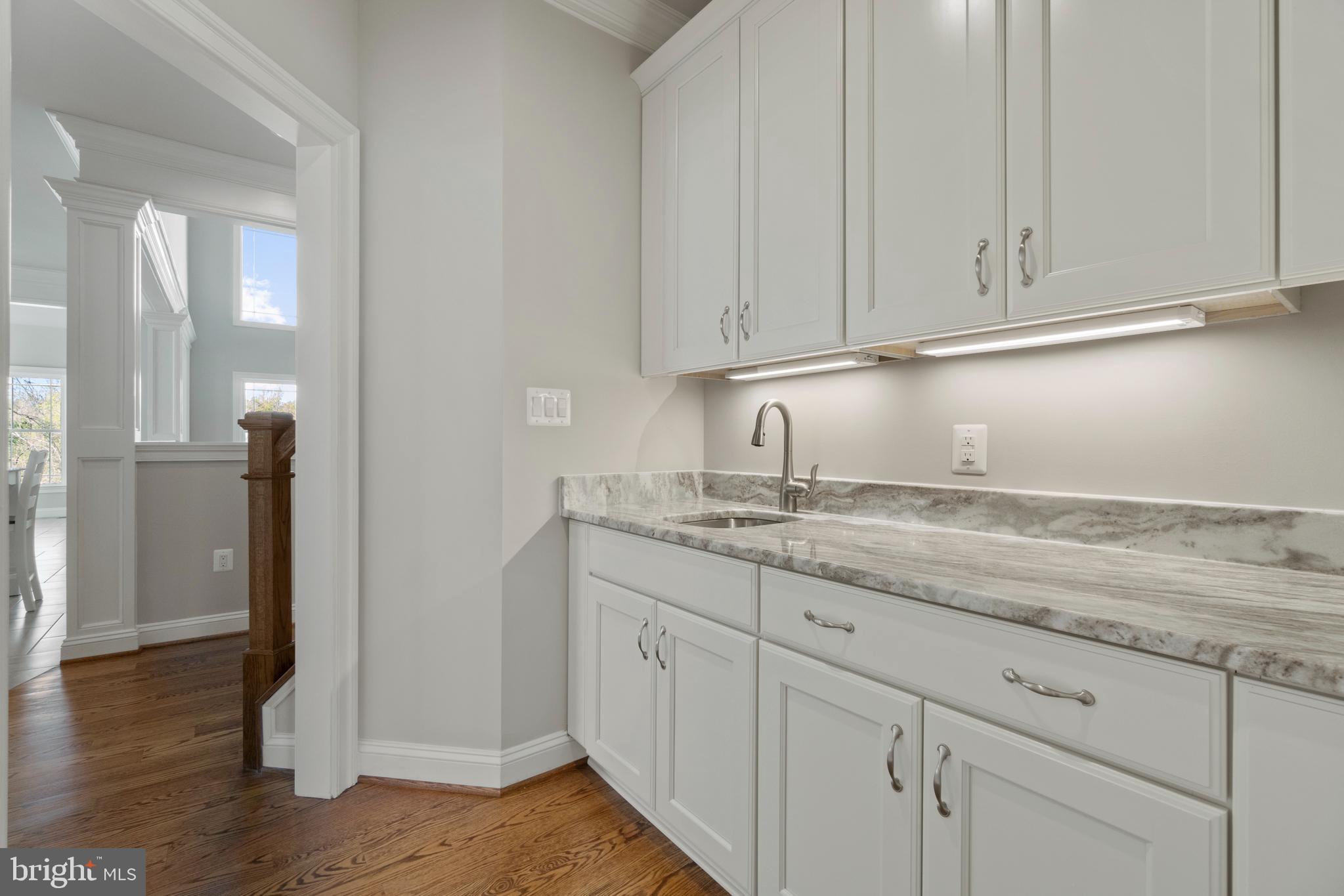 13725 Orlando Road Nokesville, VA 20181 - Photo 16 of 65 a kitchen with granite countertop white cabinets and a sink