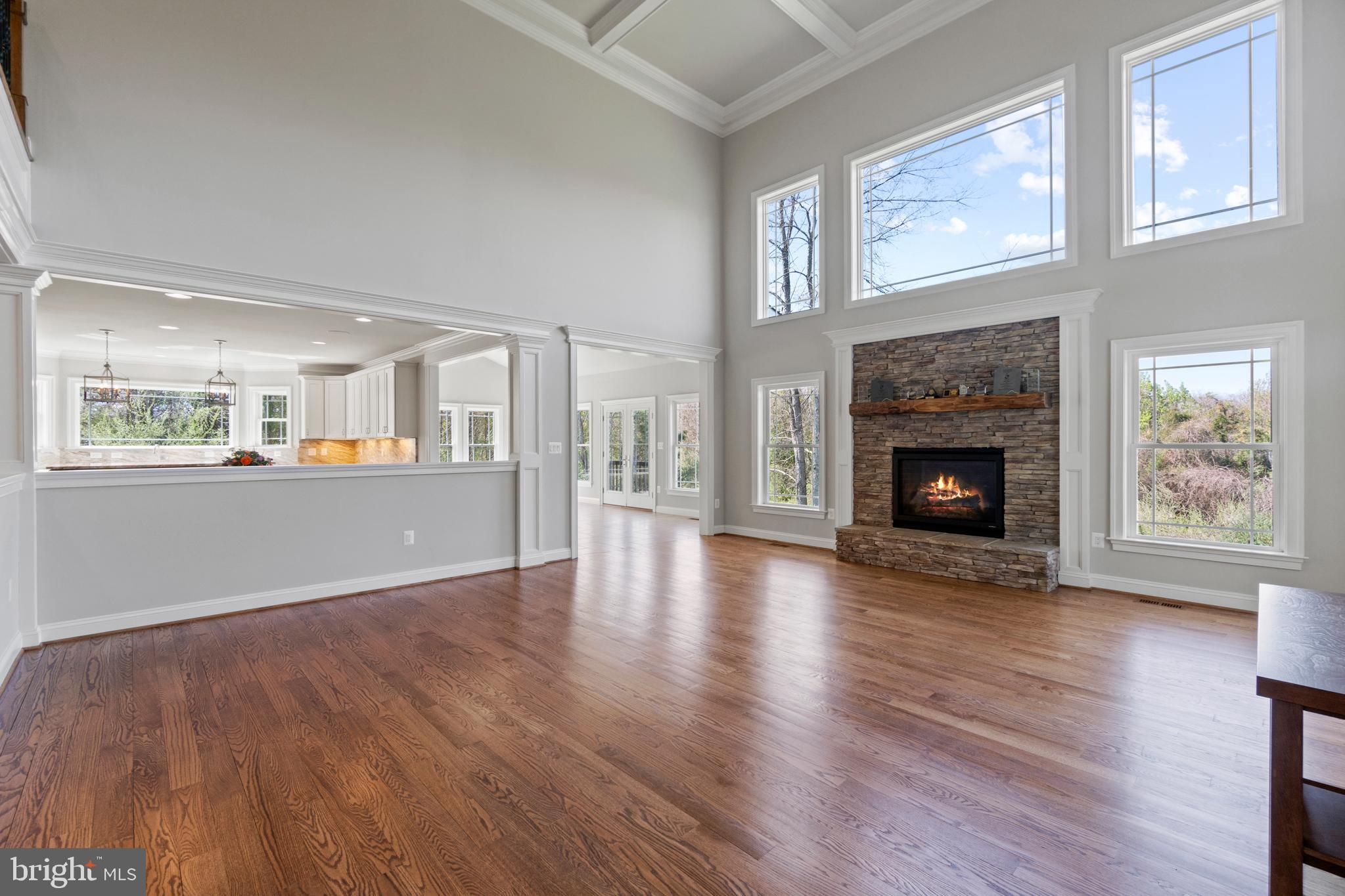 13725 Orlando Road Nokesville, VA 20181 - Photo 18 of 65 a view of an empty room with wooden floor fire place and windows
