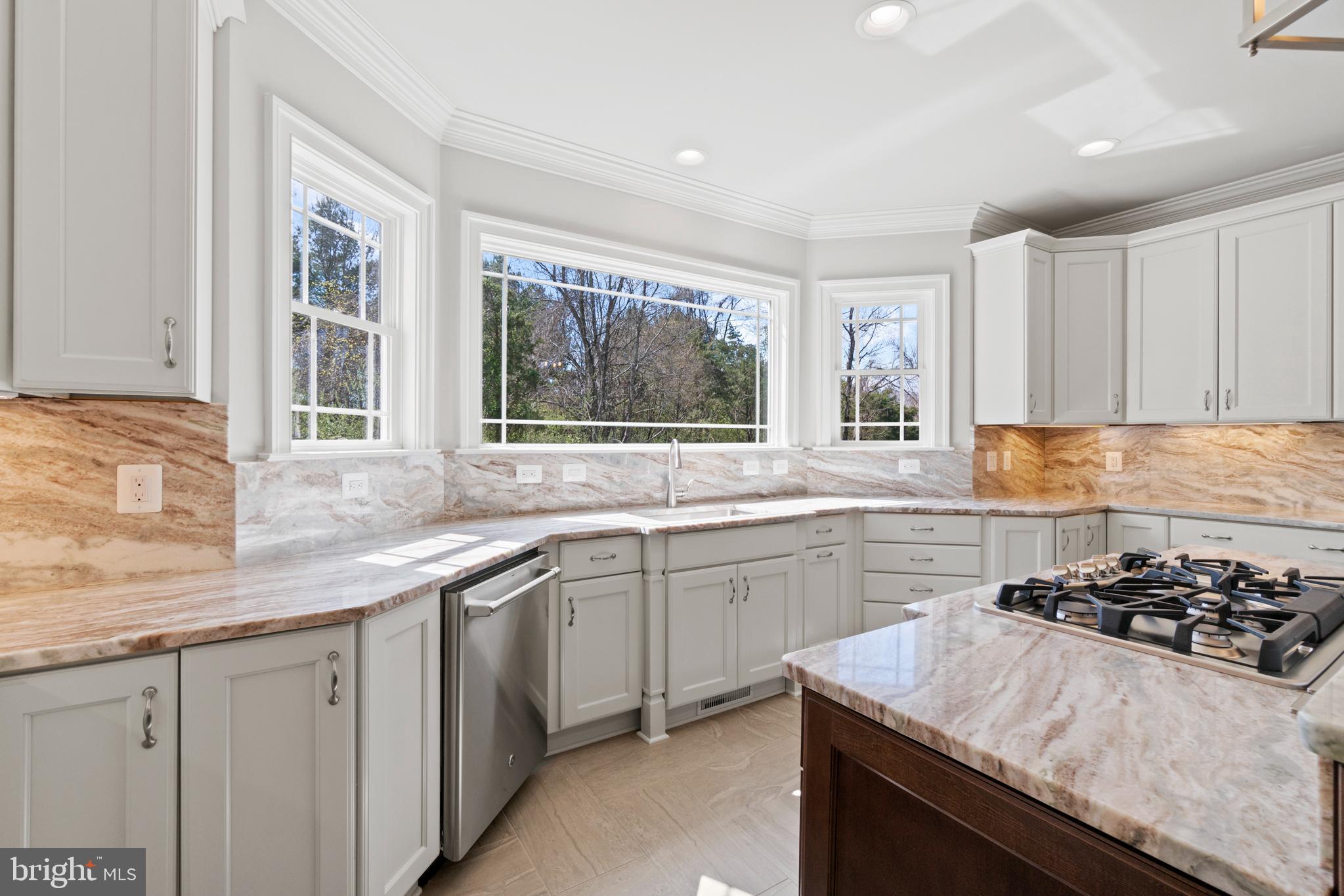 13725 Orlando Road Nokesville, VA 20181 - Photo 26 of 65 a kitchen with stainless steel appliances granite countertop a sink stove and cabinets