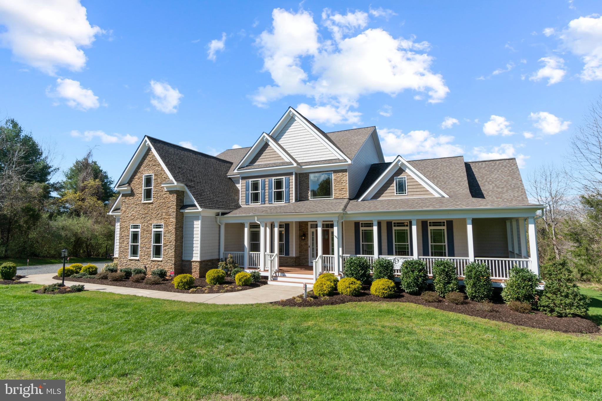 13725 Orlando Road Nokesville, VA 20181 - Photo 3 of 65 a front view of a house with swimming pool and chairs