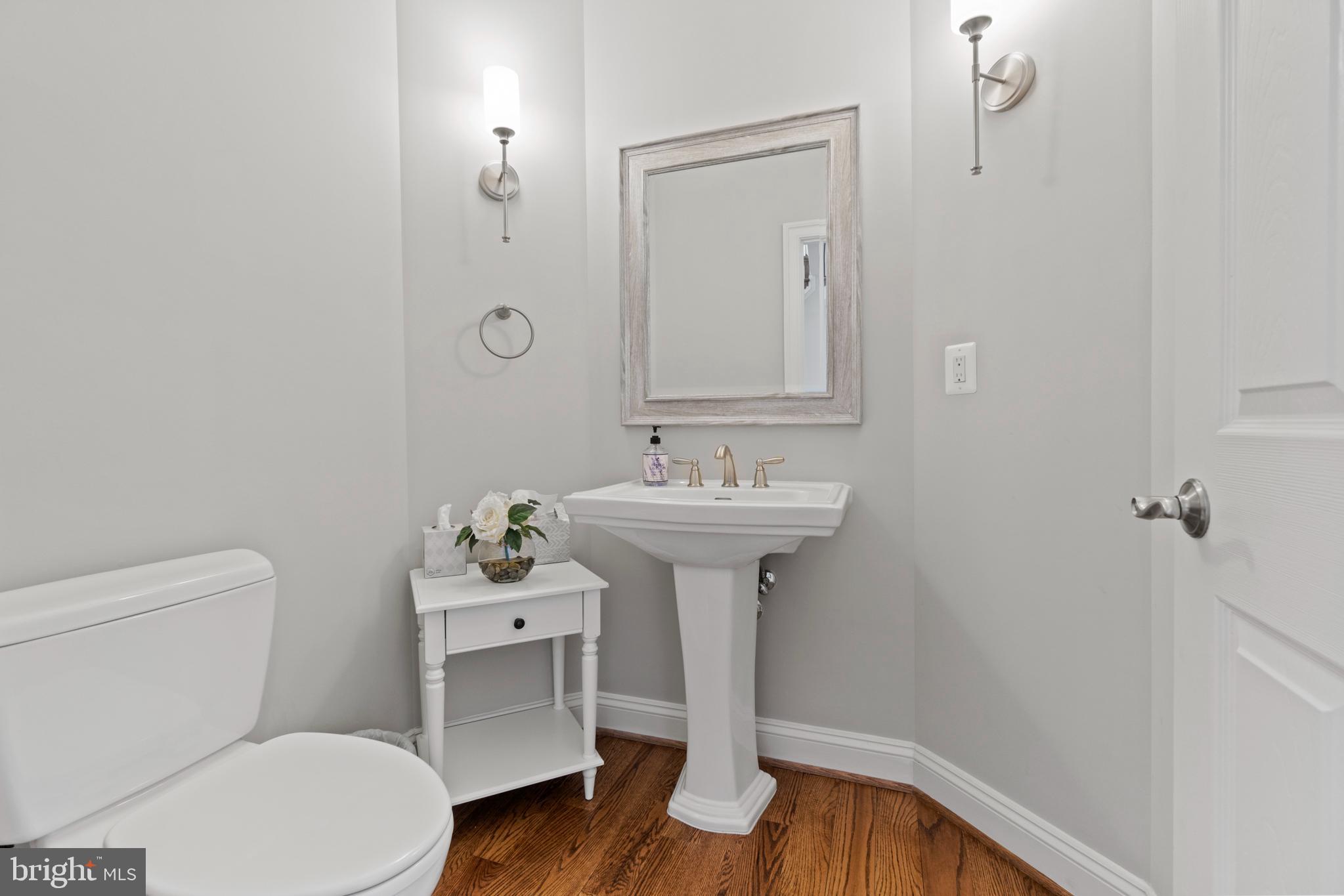13725 Orlando Road Nokesville, VA 20181 - Photo 40 of 65 a bathroom with a sink toilet and a mirror