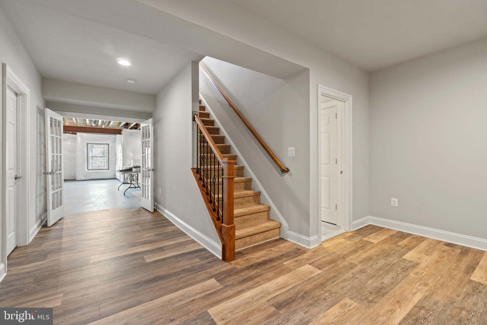 13725 Orlando Road Nokesville, VA 20181 - Photo 61 of 65 a view of a hallway with wooden floor and staircase