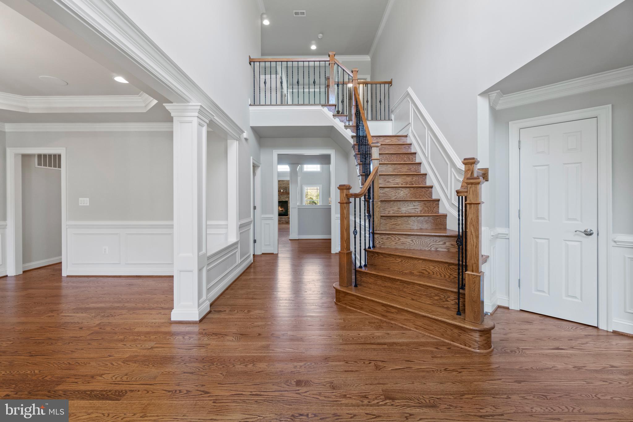 13725 Orlando Road Nokesville, VA 20181 - Photo 8 of 65 a view of a hallway with stairs wooden floor and stairs