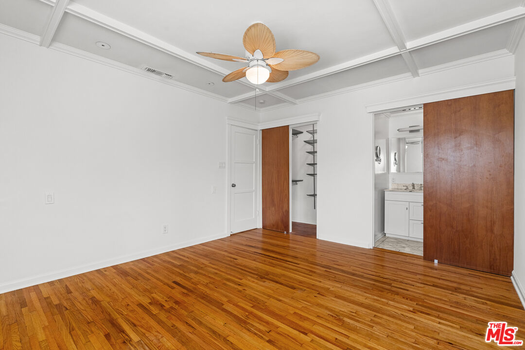 4352 Globe Avenue Culver City, CA 90230 - Photo 14 of 30 a view of a room with wooden floor and a ceiling fan