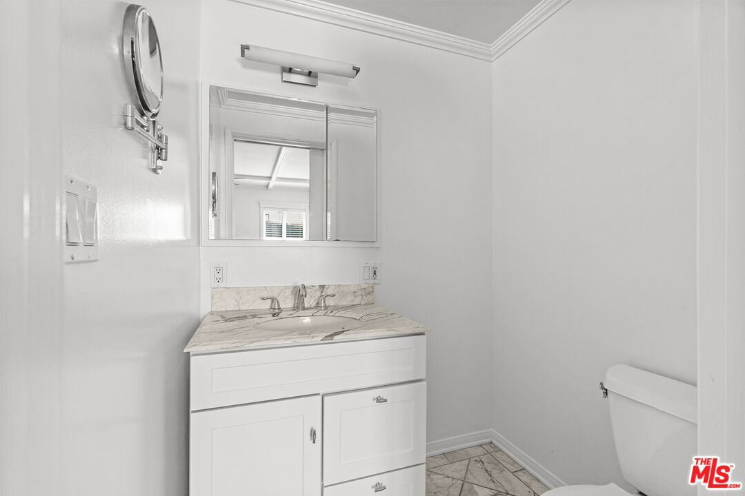 4352 Globe Avenue Culver City, CA 90230 - Photo 16 of 30 a bathroom with a sink and a mirror