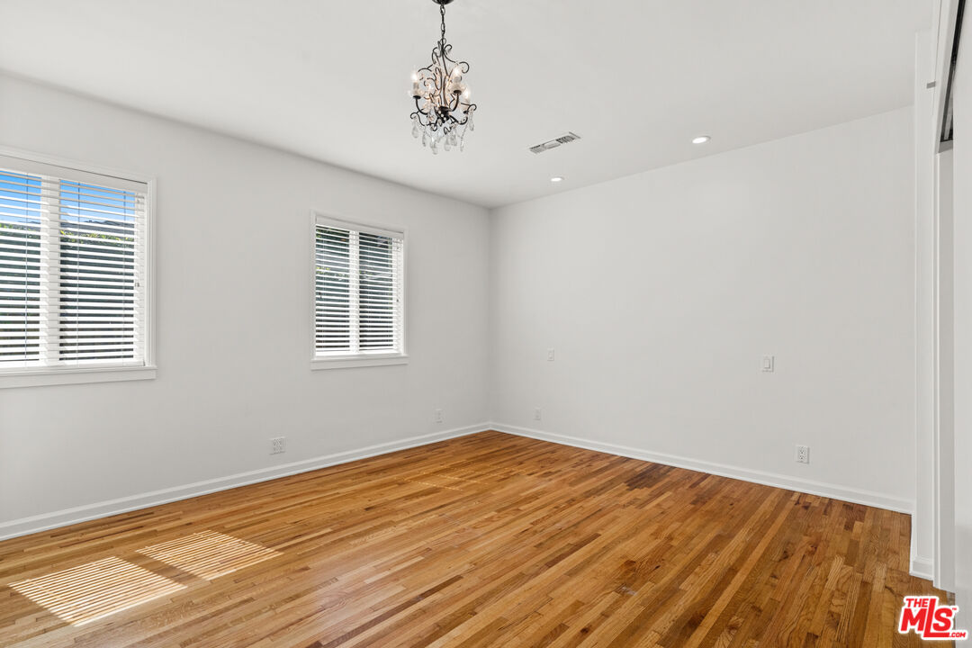 4352 Globe Avenue Culver City, CA 90230 - Photo 17 of 30 a view of empty room with wooden floor and fan