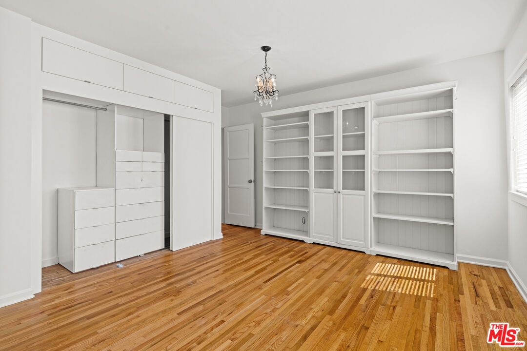 4352 Globe Avenue Culver City, CA 90230 - Photo 18 of 30 a view of a bedroom with closet and wooden floor