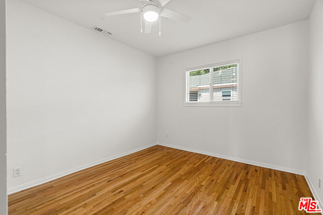 4352 Globe Avenue Culver City, CA 90230 - Photo 20 of 30 an empty room with wooden floor and windows