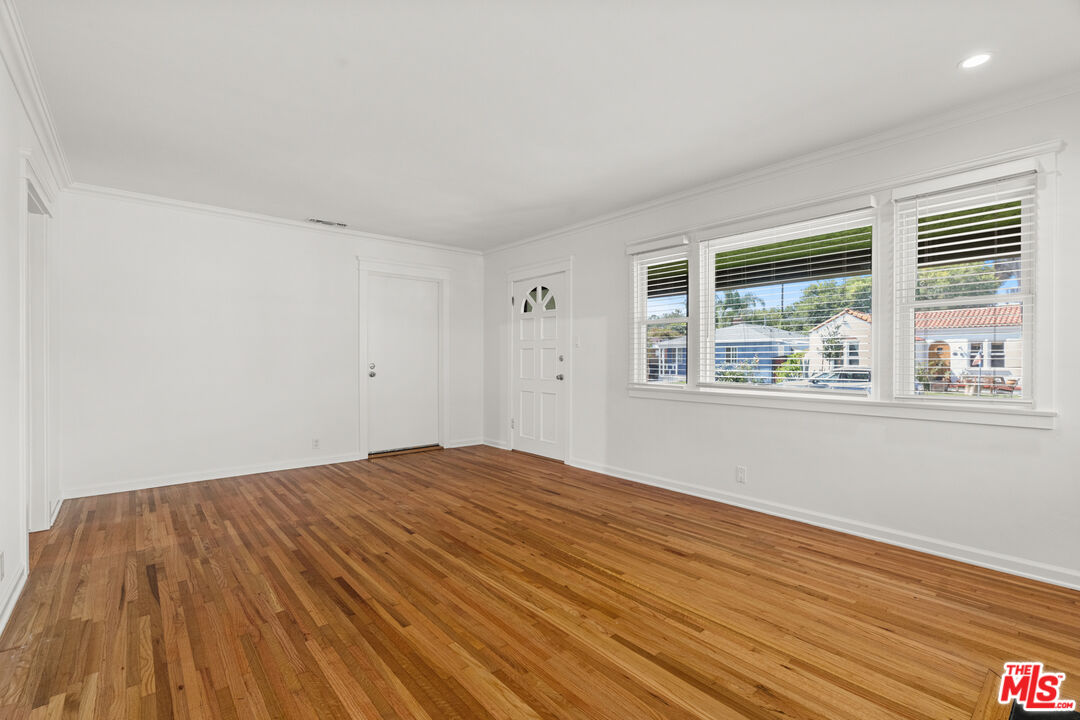 4352 Globe Avenue Culver City, CA 90230 - Photo 4 of 30 a view of empty room with wooden floor and fan