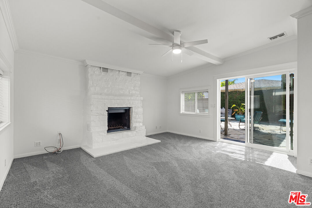 4352 Globe Avenue Culver City, CA 90230 - Photo 10 of 30 a view of an empty room with a fireplace and a window