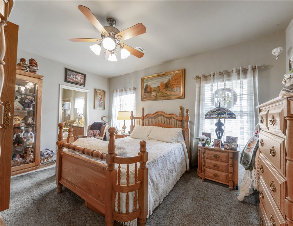 3815 Harvey Road College Station, TX 77845 - Photo 17 of 24 a bedroom with bed and a chandelier