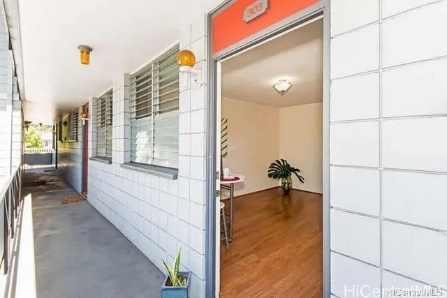 a view of a hallway with windows