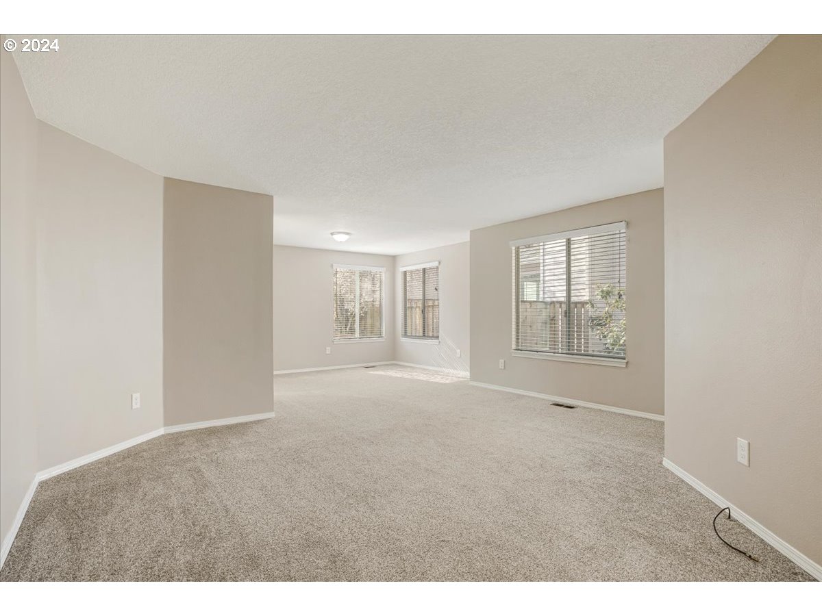 10570 Southwest Windsor Court Portland, OR 97223 - Photo 14 of 35 a view of an empty room with a window