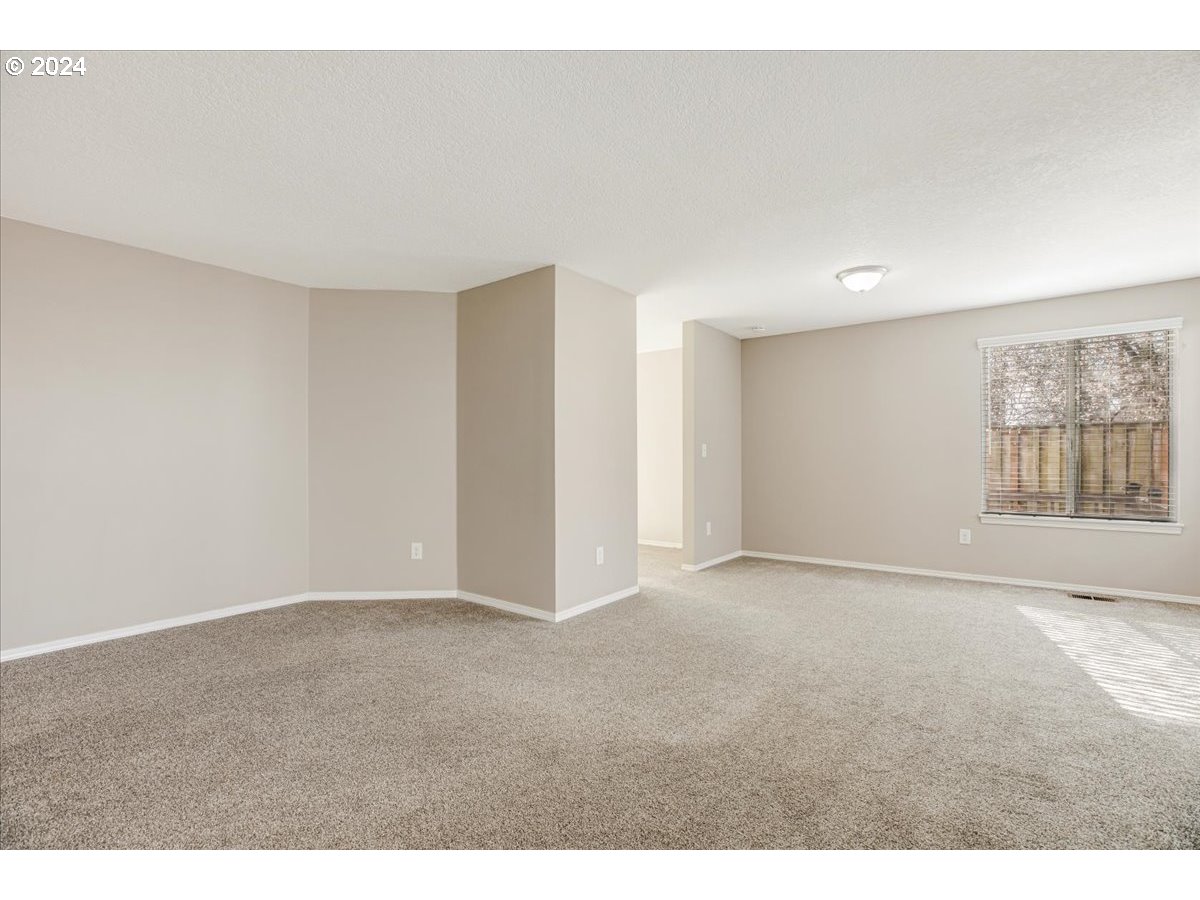 10570 Southwest Windsor Court Portland, OR 97223 - Photo 16 of 35 a view of an empty room with a window