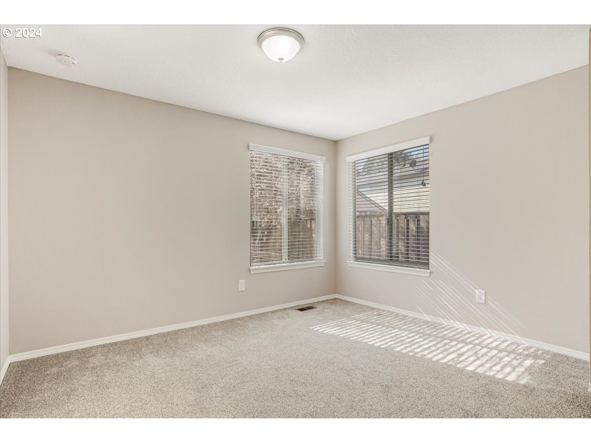 10570 Southwest Windsor Court Portland, OR 97223 - Photo 17 of 35 a view of an empty room with a window