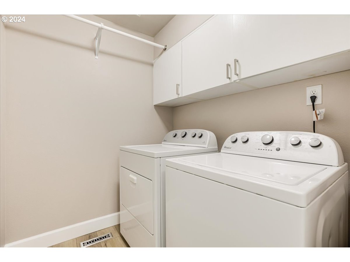 10570 Southwest Windsor Court Portland, OR 97223 - Photo 31 of 35 a utility room with dryer and washer