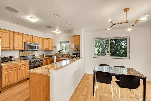 a bathroom with a sink toilet vanity and shower