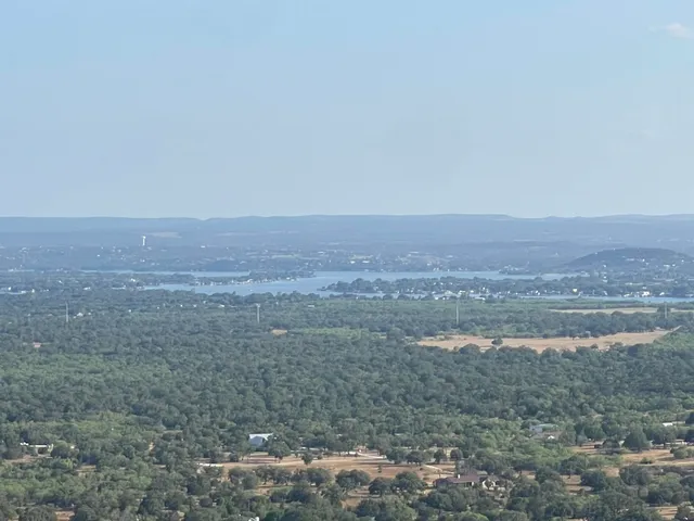 a view of roof deck with patio