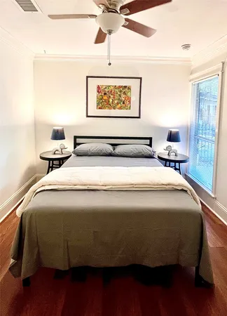 a bedroom with a bed and window