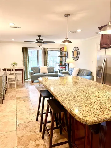 a kitchen with a table and chairs in it