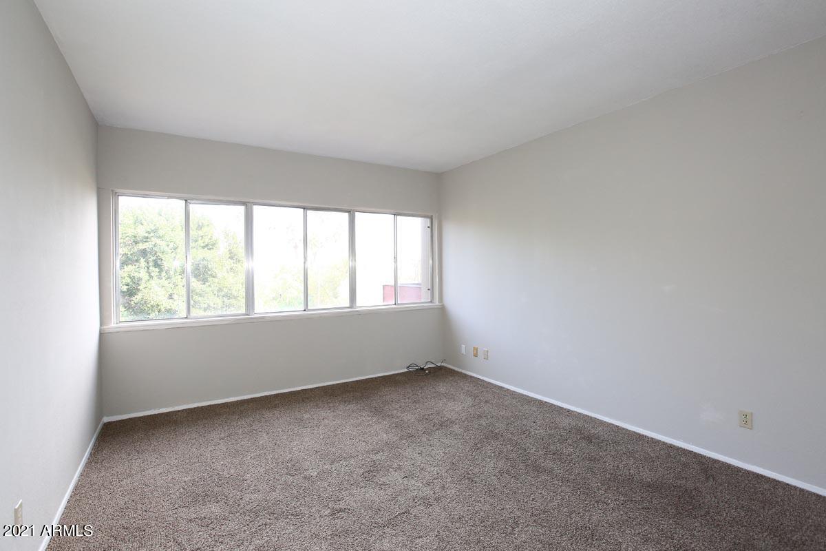353 East Thomas Road, Unit C406 Phoenix, AZ 85012 - Photo 15 of 31 Guest Bedroom