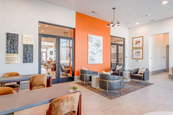 a living room with furniture a flat screen tv and a large window