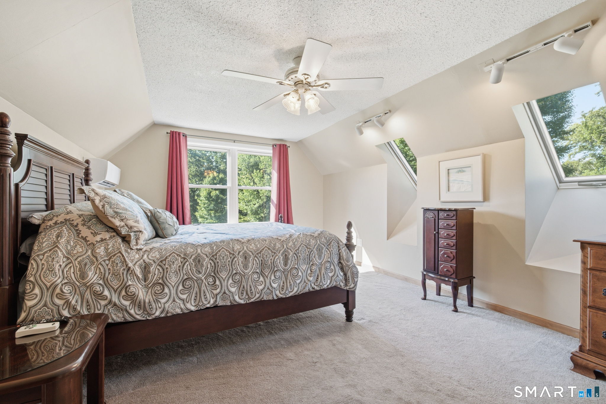141 Hop River Road Coventry, CT 06238 - Photo 18 of 40 a bed sitting in a bedroom next to a window