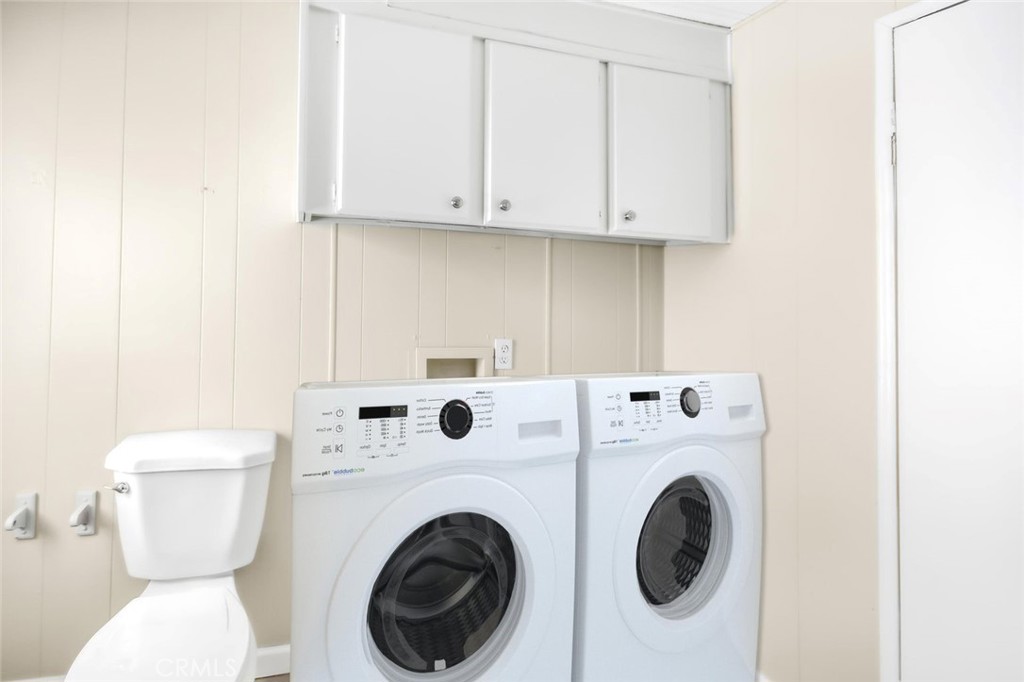 45131 28th Street East, Unit 19 Lancaster, CA 93535 - Photo 13 of 14 a utility room with dryer and washer