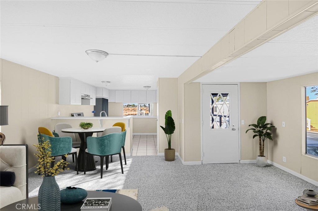 45131 28th Street East, Unit 19 Lancaster, CA 93535 - Photo 2 of 14 a view of a livingroom with furniture window and wooden floor