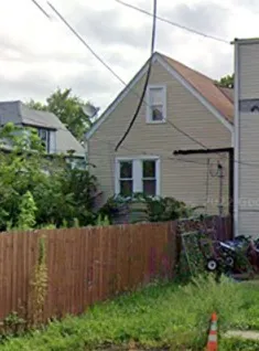 a front view of house with garden