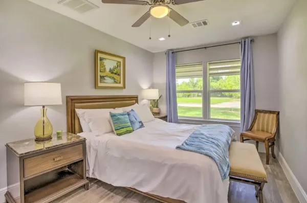 a bedroom with a bed and a table