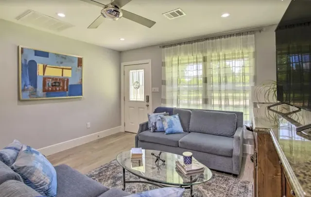a living room with furniture and a window