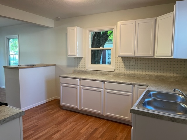 108 South 12th Street Rochelle, IL 61068 - Photo 5 of 17 a kitchen with stainless steel appliances granite countertop a sink stove and cabinets