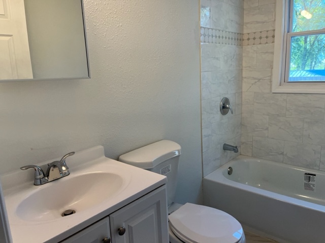 108 South 12th Street Rochelle, IL 61068 - Photo 8 of 17 a bathroom with a sink toilet and shower