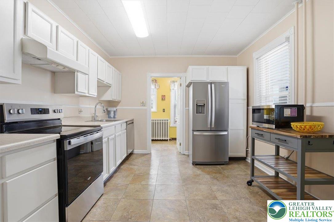 525 Ridge Street Emmaus, PA 18049 - Photo 18 of 68 This spacious kitchen offers ample cabinetry, modern appliances, and a seamless flow for daily living.