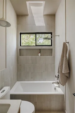a bathroom with a sink bathtub and a toilet