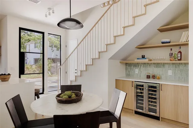 a dining room with furniture and window