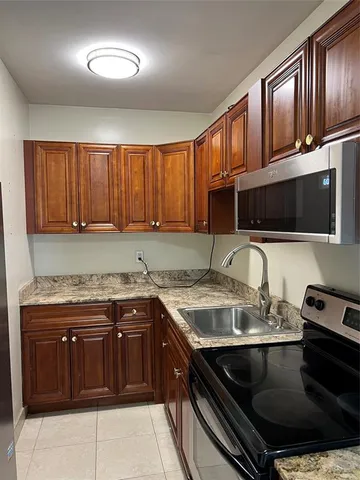 a kitchen with a stove and a sink