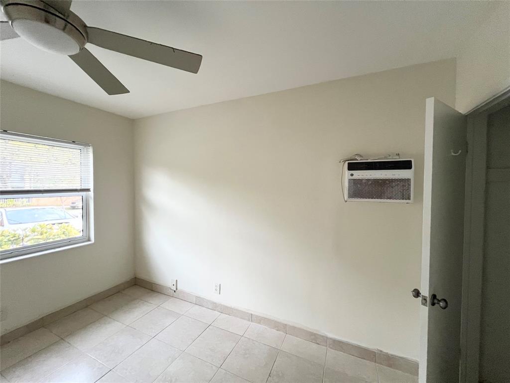 431 Southeast 19th Avenue, Unit 2 Pompano Beach, FL 33060 - Photo 5 of 7 a view of an empty room with a window