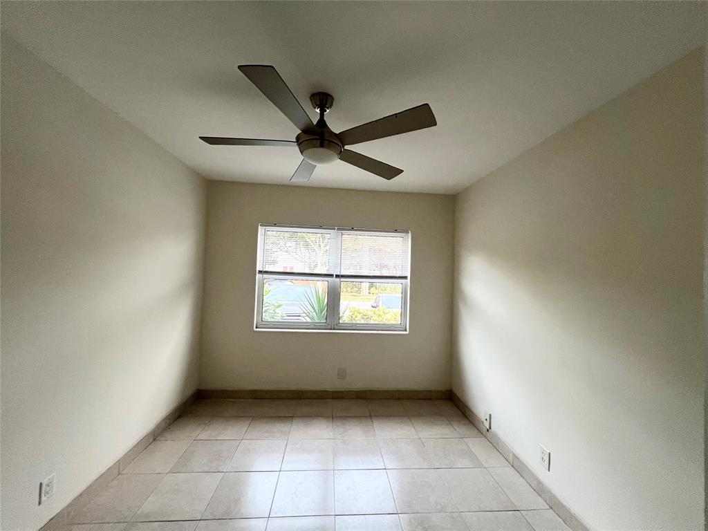 431 Southeast 19th Avenue, Unit 2 Pompano Beach, FL 33060 - Photo 6 of 7 a view of an empty room with a window