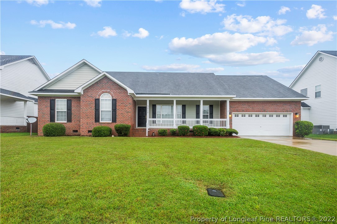 3612 Talus Road Fayetteville, NC 28306 - Photo 1 of 29 a front view of a house with a yard and garage
