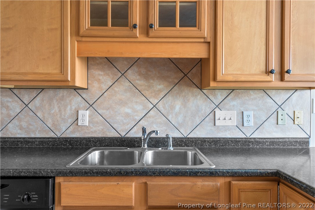 3612 Talus Road Fayetteville, NC 28306 - Photo 13 of 29 a kitchen sink with granite countertop