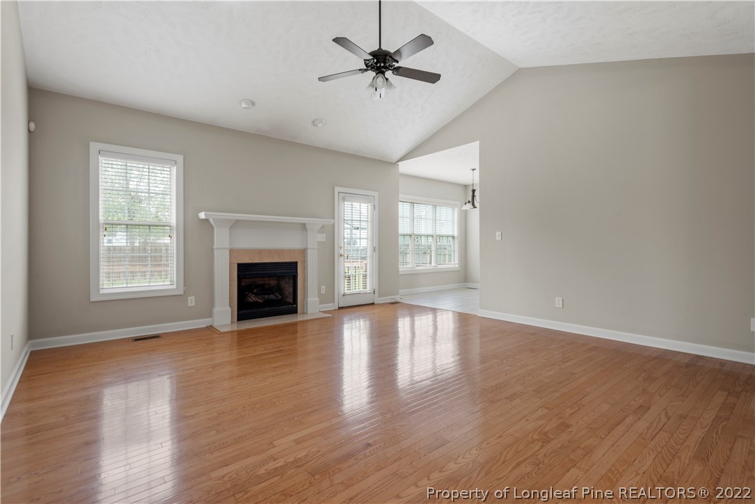 3612 Talus Road Fayetteville, NC 28306 - Photo 16 of 29 an empty room with windows and a fireplace