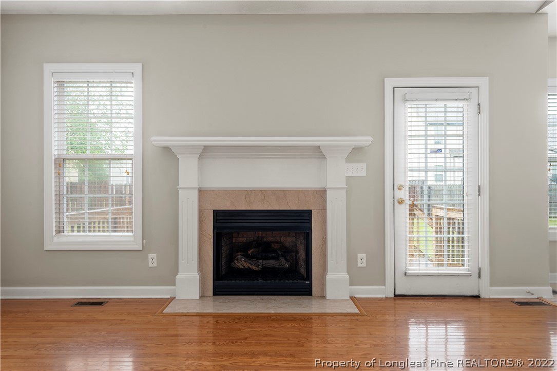 3612 Talus Road Fayetteville, NC 28306 - Photo 17 of 29 a living room with furniture and a fireplace