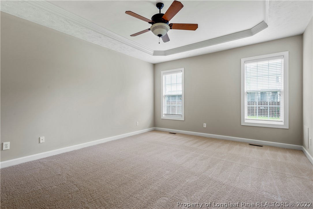 3612 Talus Road Fayetteville, NC 28306 - Photo 19 of 29 an empty room with window and ceiling fan