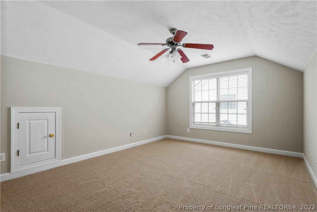 3612 Talus Road Fayetteville, NC 28306 - Photo 25 of 29 a view of a room with a ceiling fan and windows