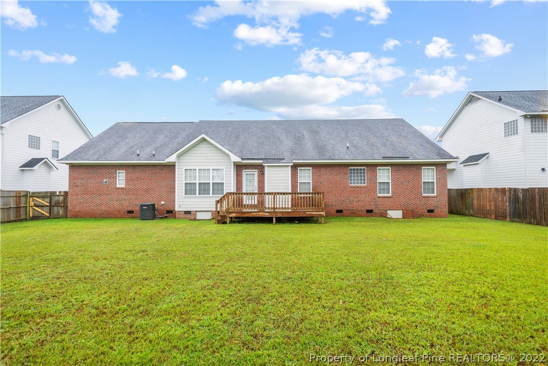 3612 Talus Road Fayetteville, NC 28306 - Photo 29 of 29 a view of a yard in front of a house with a garden